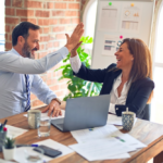 Nanda & Associate Lawyers Canada - a man and a woman high-fiving each other
