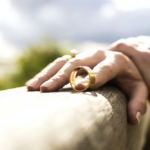 Nanda & Associate Lawyers Canada - a woman holding a wedding ring with a finger