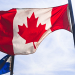 Nanda & Associate Lawyers Canada - Canadian flag hoisted in the sky