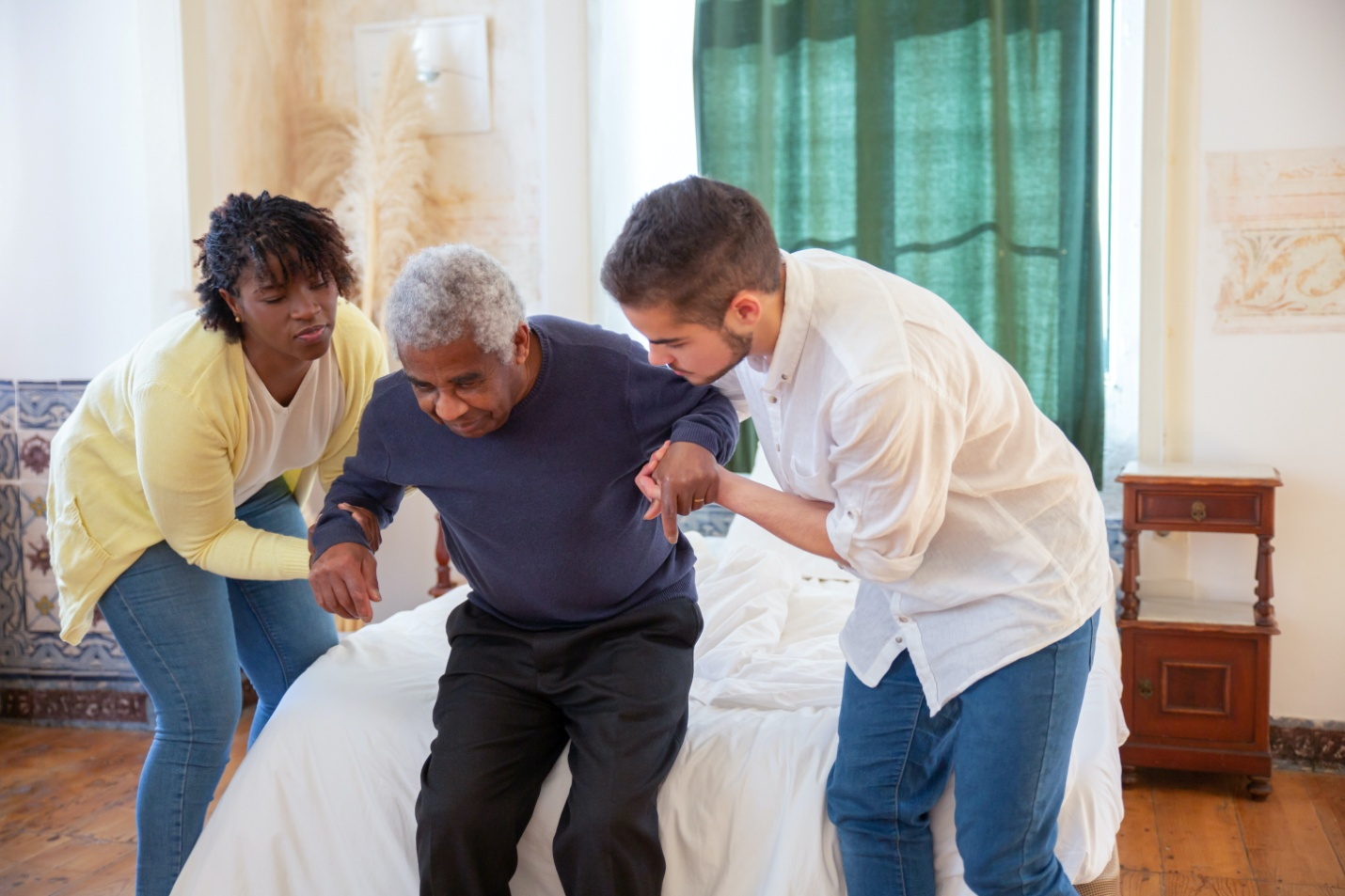 Nanda & Associate Lawyers Canada - Canadian caregivers helping a man