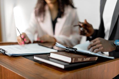 A team of lawyers examining legal paperwork