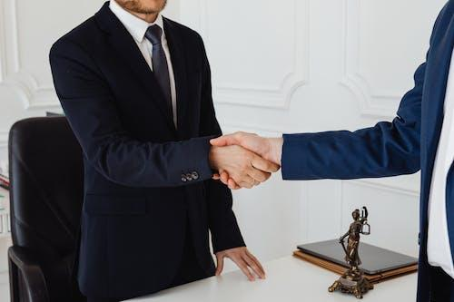 Nanda & Associate Lawyers Canada - A lawyer shaking hands with a client