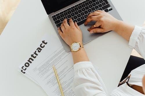 A civil litigation lawyer drafting a legal contract