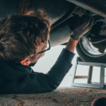 Nanda & Associate Lawyers Canada - A mechanic repairing a car