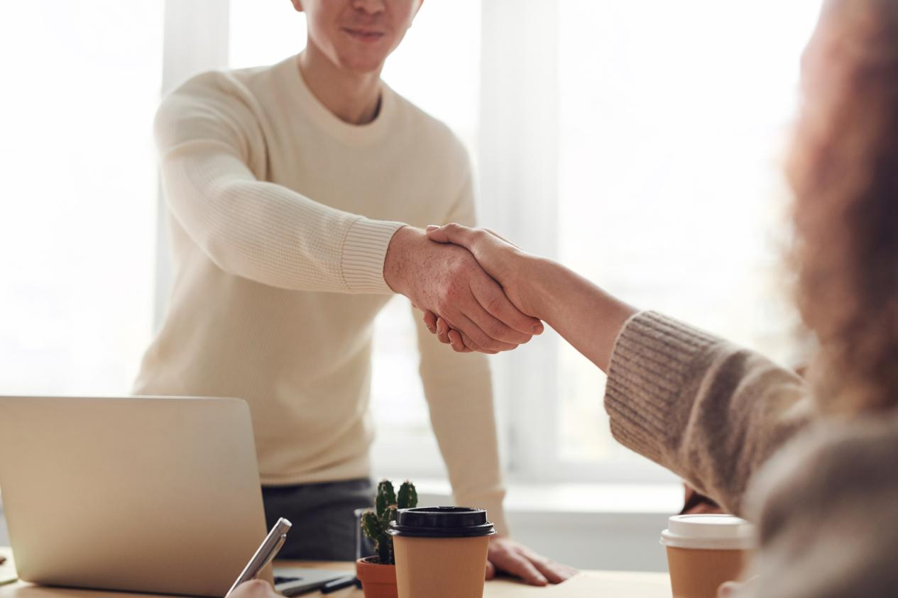 Nanda & Associate Lawyers Canada - Two people shaking hands