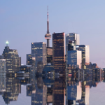 Nanda & Associate Lawyers Canada - A city skyline by the water at night
