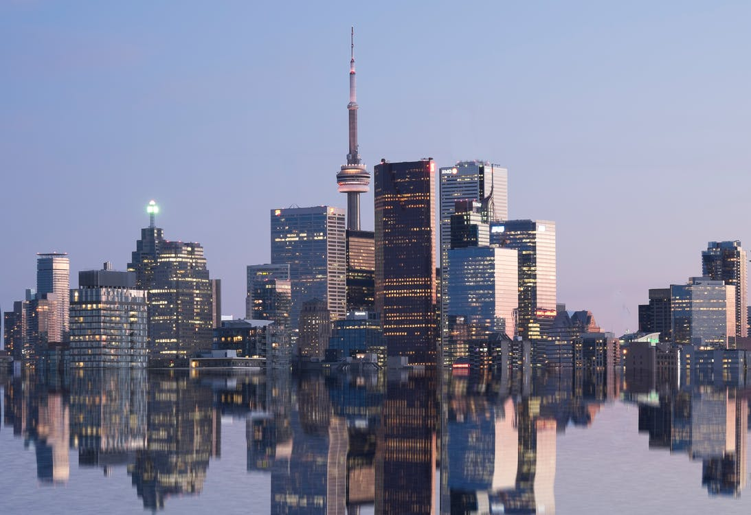 Nanda & Associate Lawyers Canada - A city skyline by the water at night
