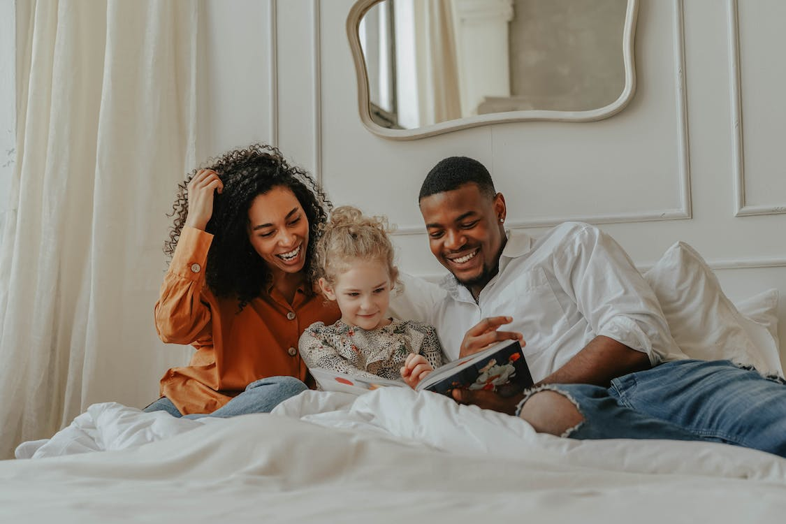 Nanda & Associate Lawyers Canada - A family reading a book