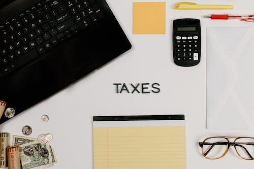 A calculator next to the word taxes