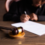 Nanda & Associate Lawyers Canada - A judge signing documents
