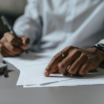 Nanda & Associate Lawyers Canada - a business lawyer filling out a document