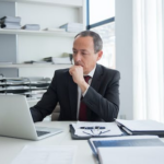 Nanda & Associate Lawyers Canada - an immigration lawyer looking at his laptop