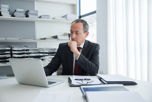 Nanda & Associate Lawyers Canada - an immigration lawyer looking at his laptop