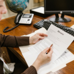 Nanda & Associate Lawyers Canada - A Female Lawyer Holding Documents