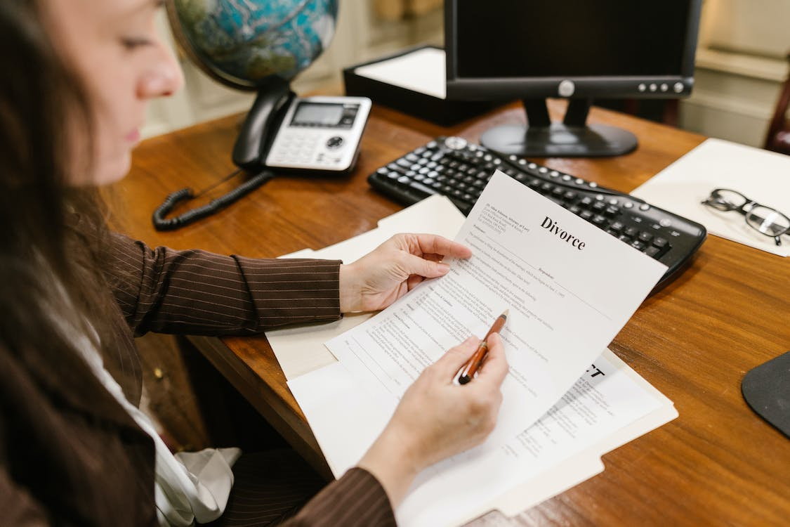 Nanda & Associate Lawyers Canada - A Female Lawyer Holding Documents