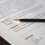 Nanda & Associate Lawyers Canada - A pen on a document