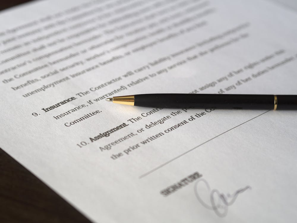 Nanda & Associate Lawyers Canada - A pen on a document