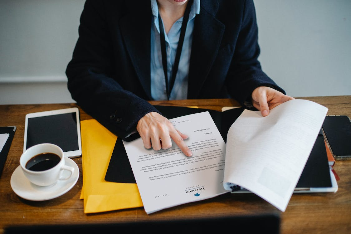 Nanda & Associate Lawyers Canada - A person going through a document