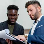 Nanda & Associate Lawyers Canada - Two people looking at a document
