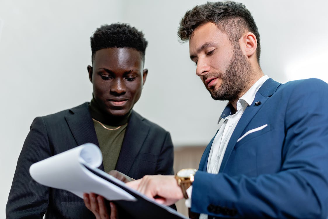 Nanda & Associate Lawyers Canada - Two people looking at a document