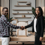 Nanda & Associate Lawyers Canada - Lawyer and happy client shaking hands after successfully acquiring permanent residence in Canada