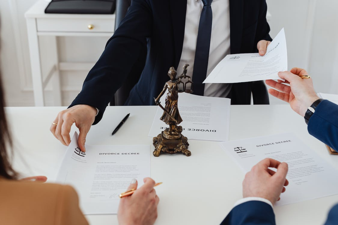 Nanda & Associate Lawyers Canada - Lawyers Discussing Divorce Documents