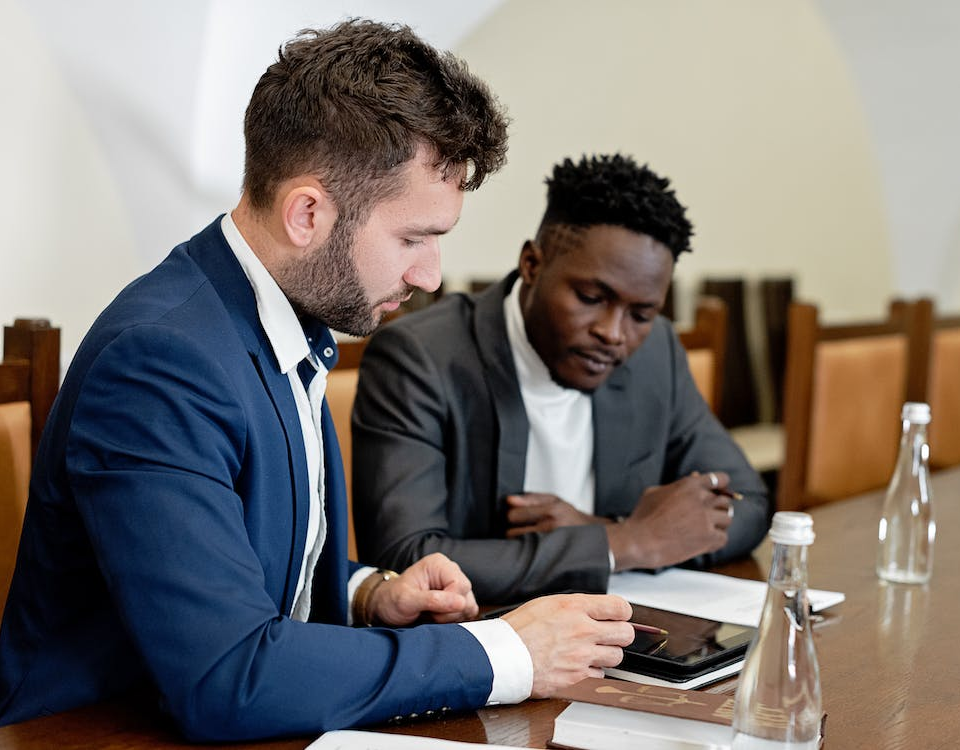 Nanda & Associate Lawyers Canada - Two Professionals Analyzing Documents Together