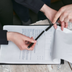 Nanda & Associate Lawyers Canada - A person reviewing a document