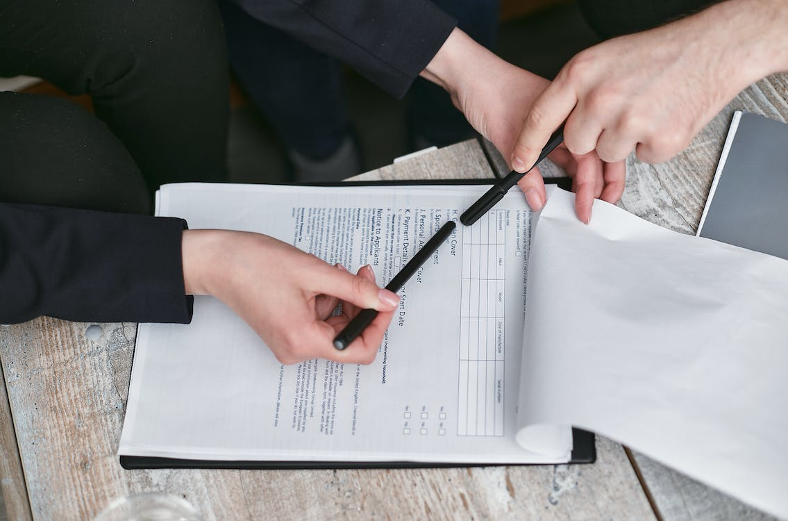 Nanda & Associate Lawyers Canada - A person reviewing a document